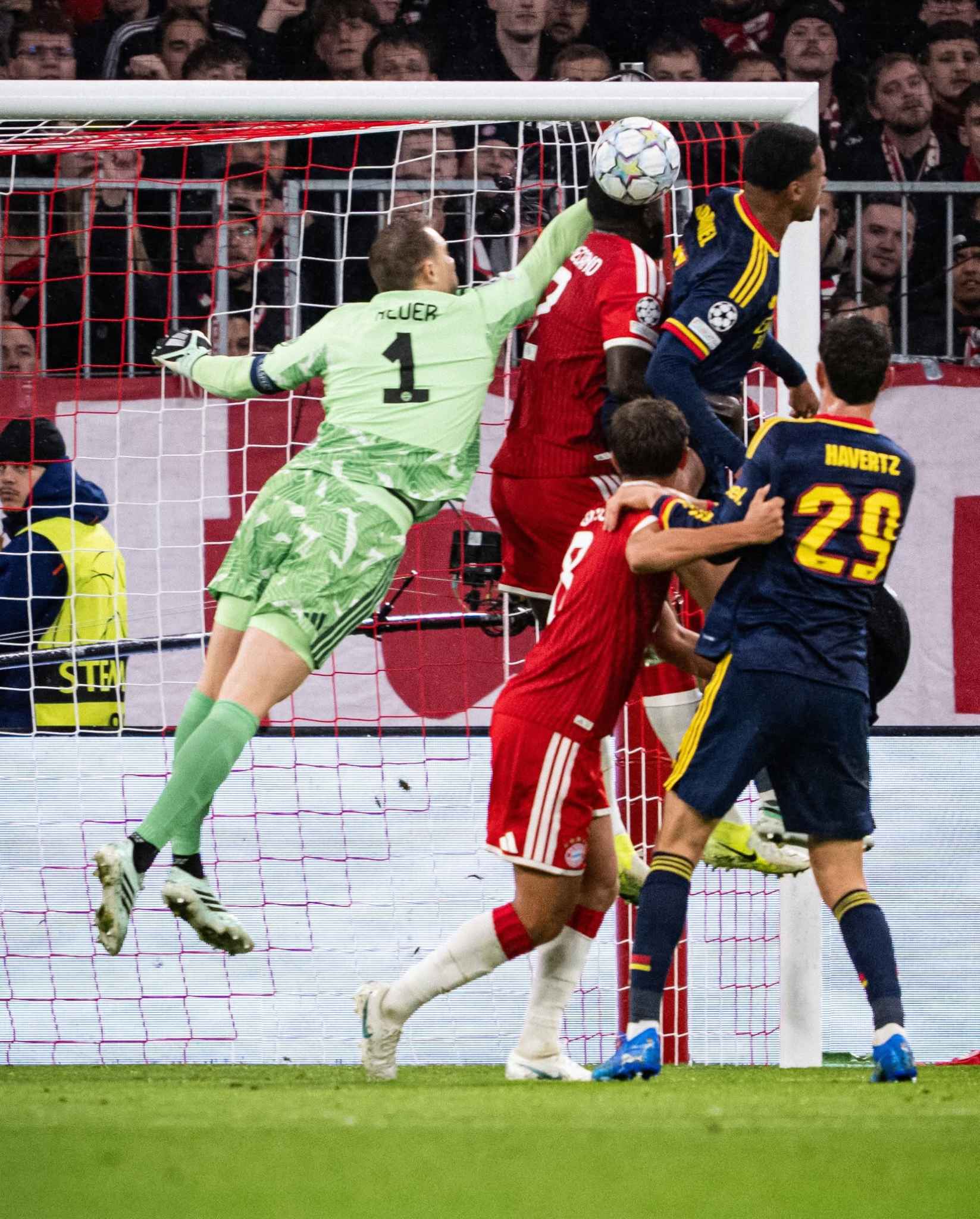 Both sides compete fiercely during the Champions League clash.