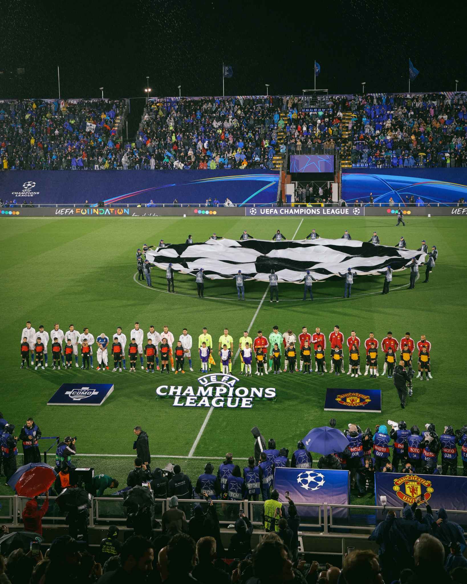 Players and officials gather before kickoff at the stadium.