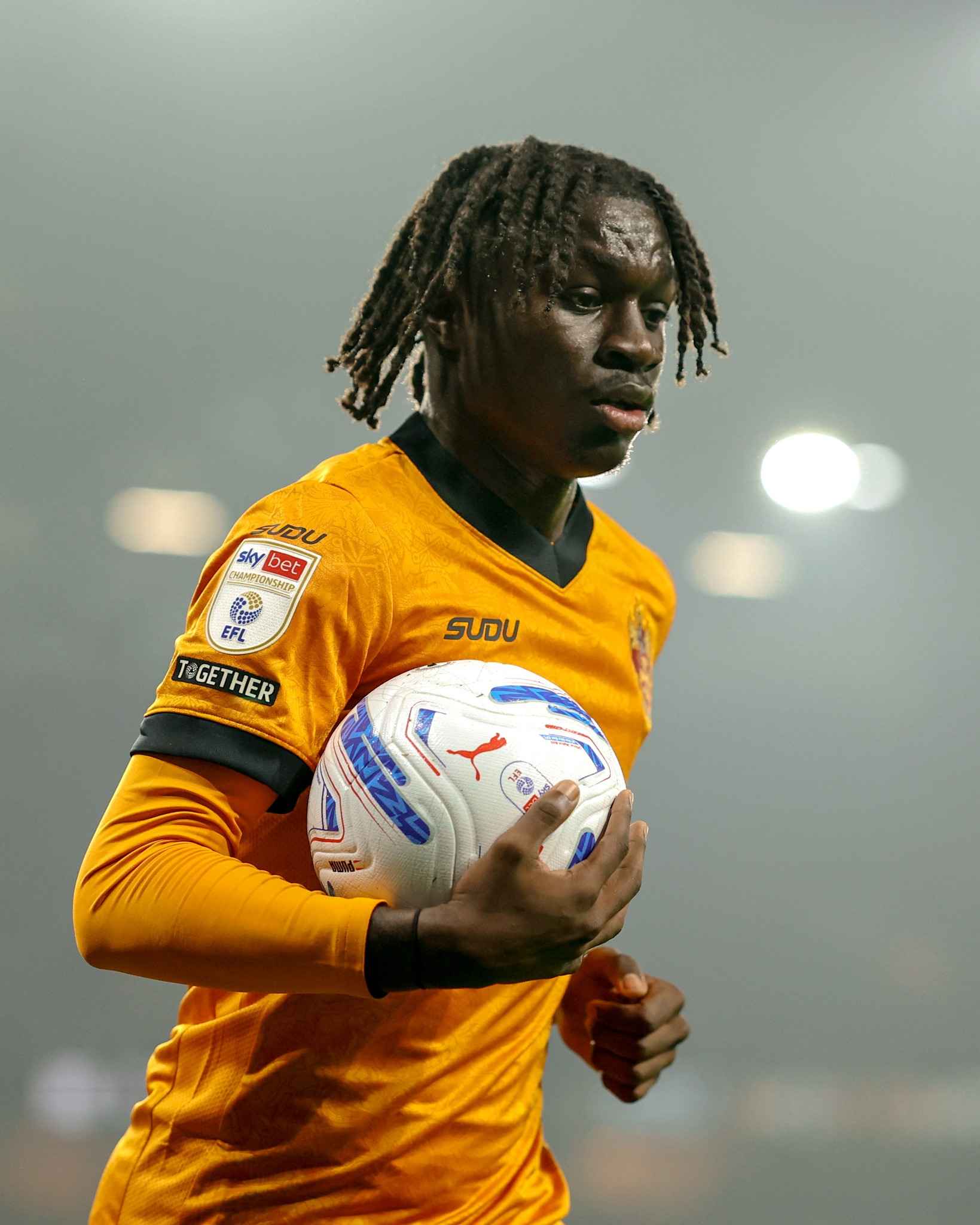 A Wolves player holds the ball as he looks to build an attack.