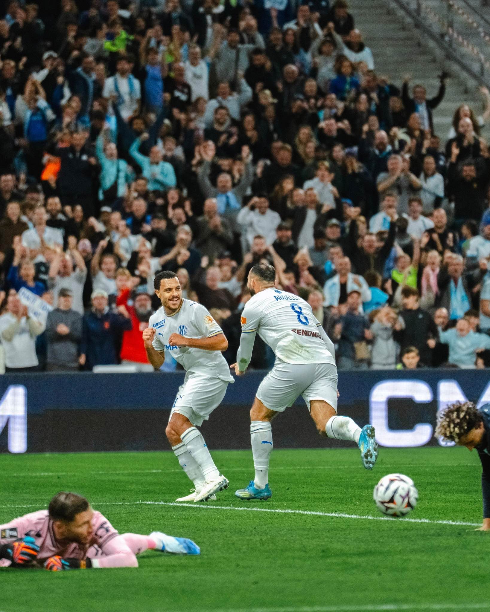 Marseille players celebrate after finding the net at the Vélodrome.
