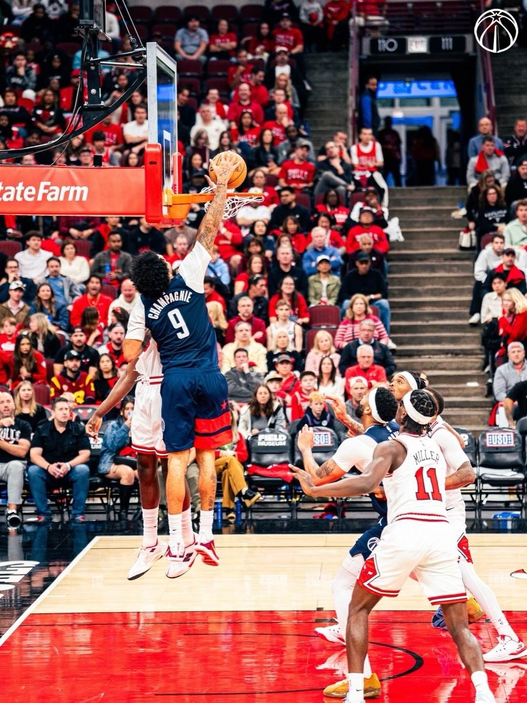 Champagnie attacks the basket during the Wizards’ win over Chicago.