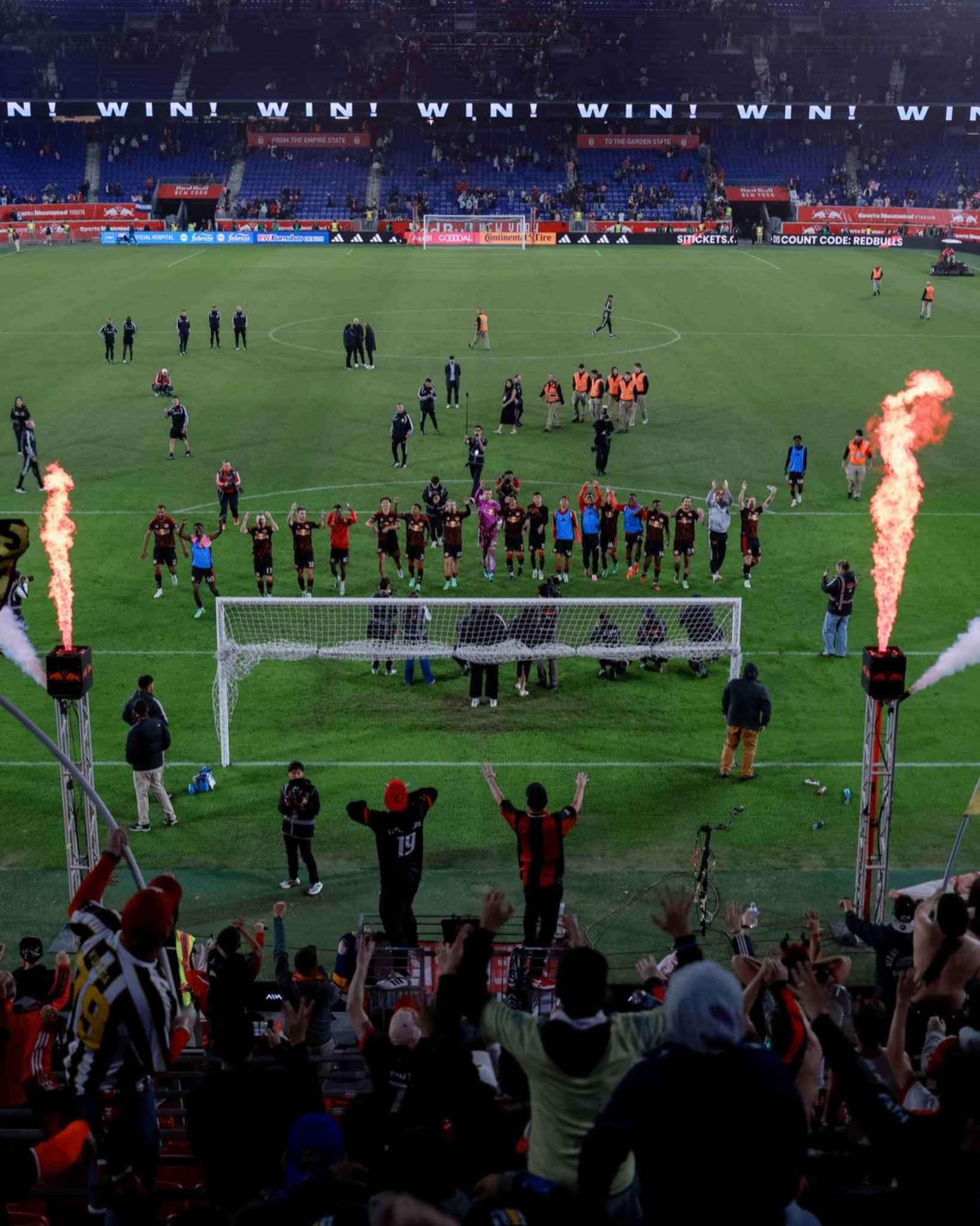 New York Red Bulls players celebrate with their fans after the match.