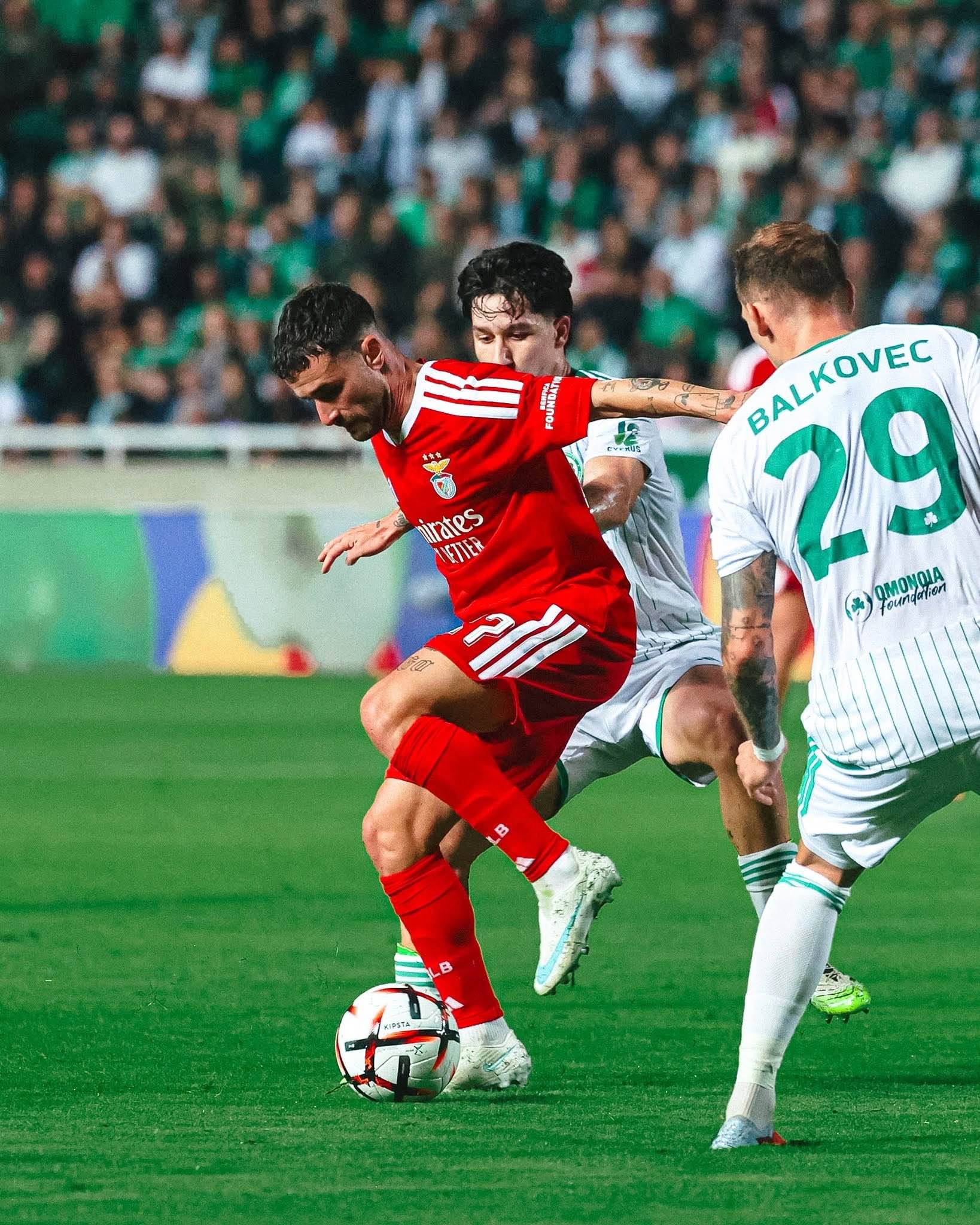Benfica players fight for possession during their 4-1 Europa League victory.