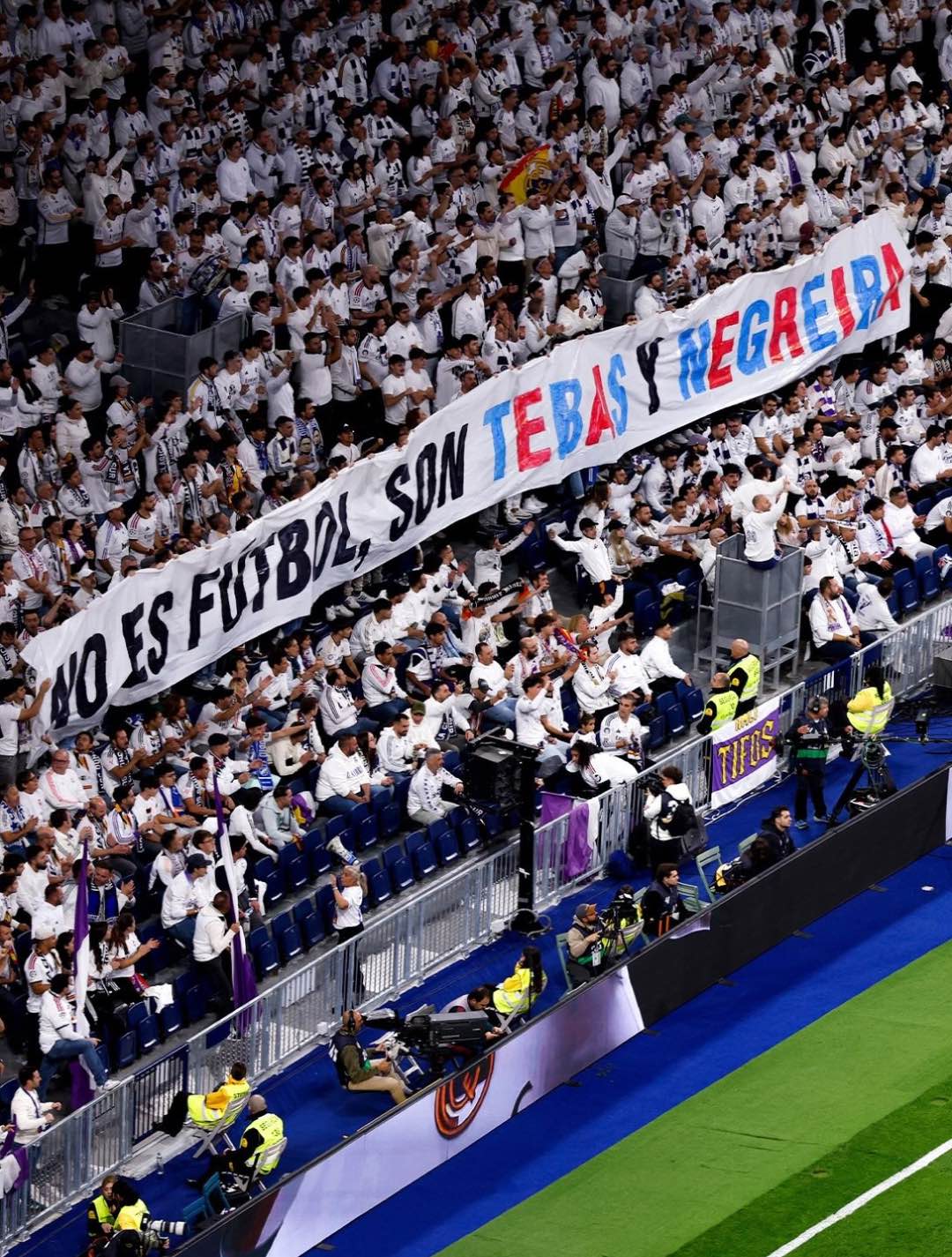 Real Madrid supporters fill the stands and celebrate their team’s impressive victory.