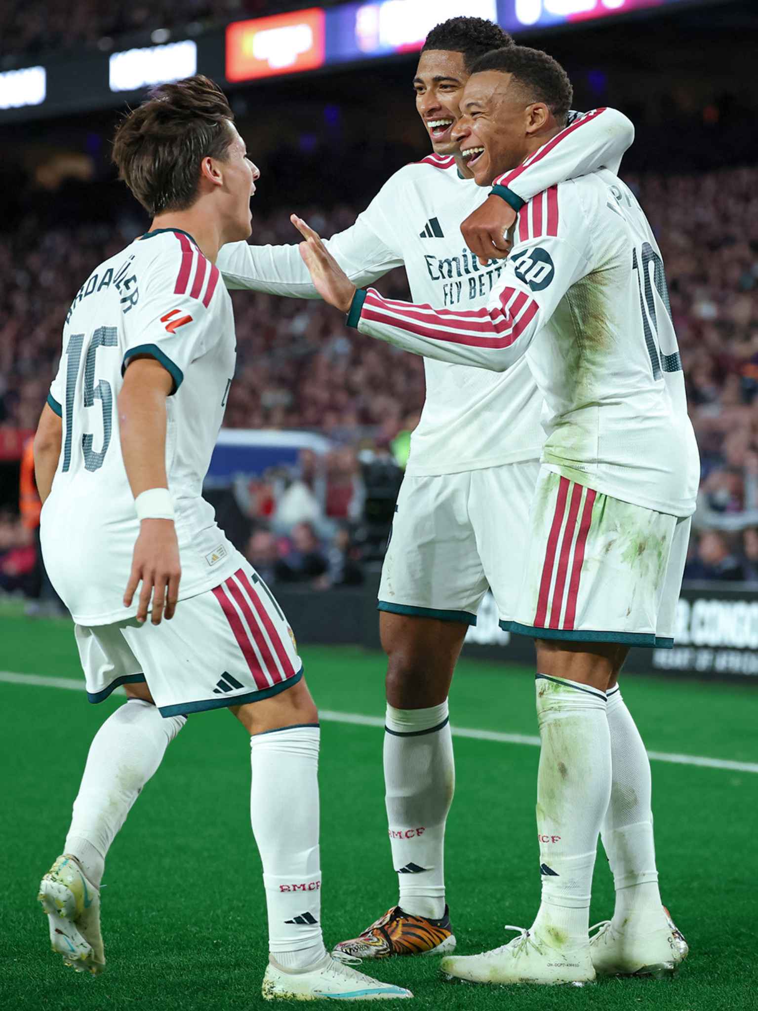 Mbappé celebrates alongside his Real Madrid teammates after finding the net.