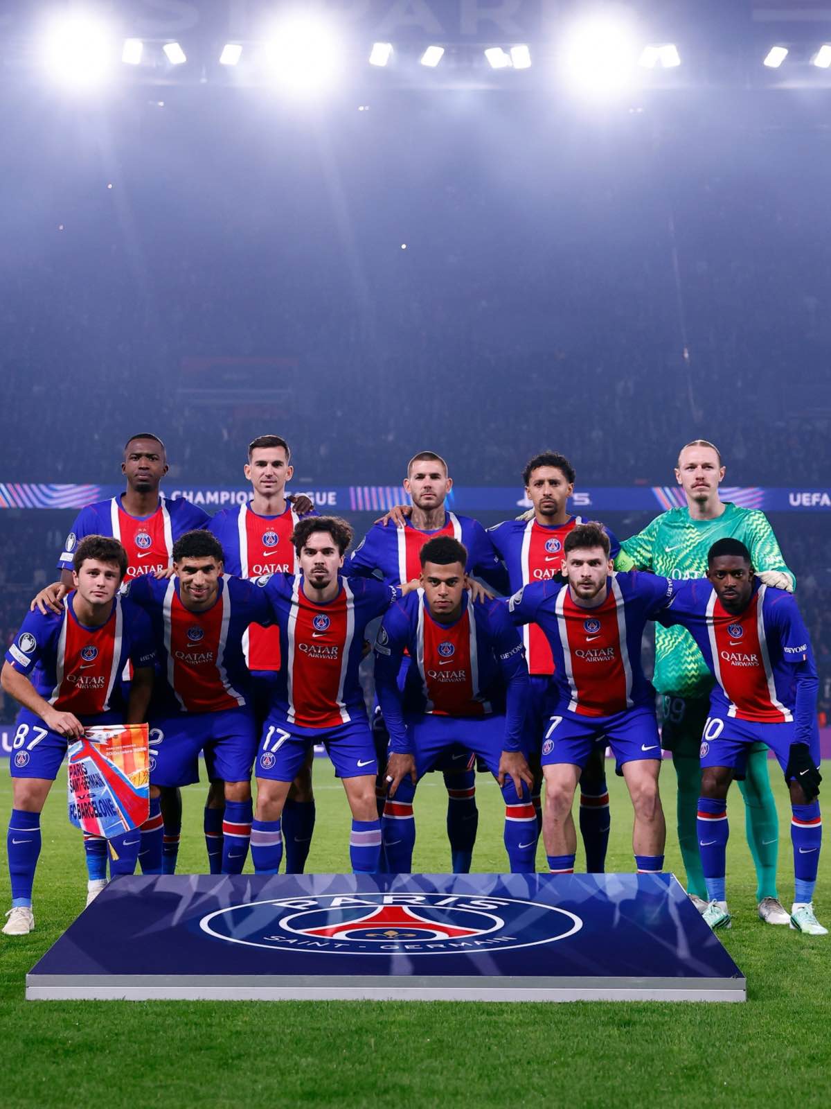 The PSG squad poses for a team photo before facing Barcelona.