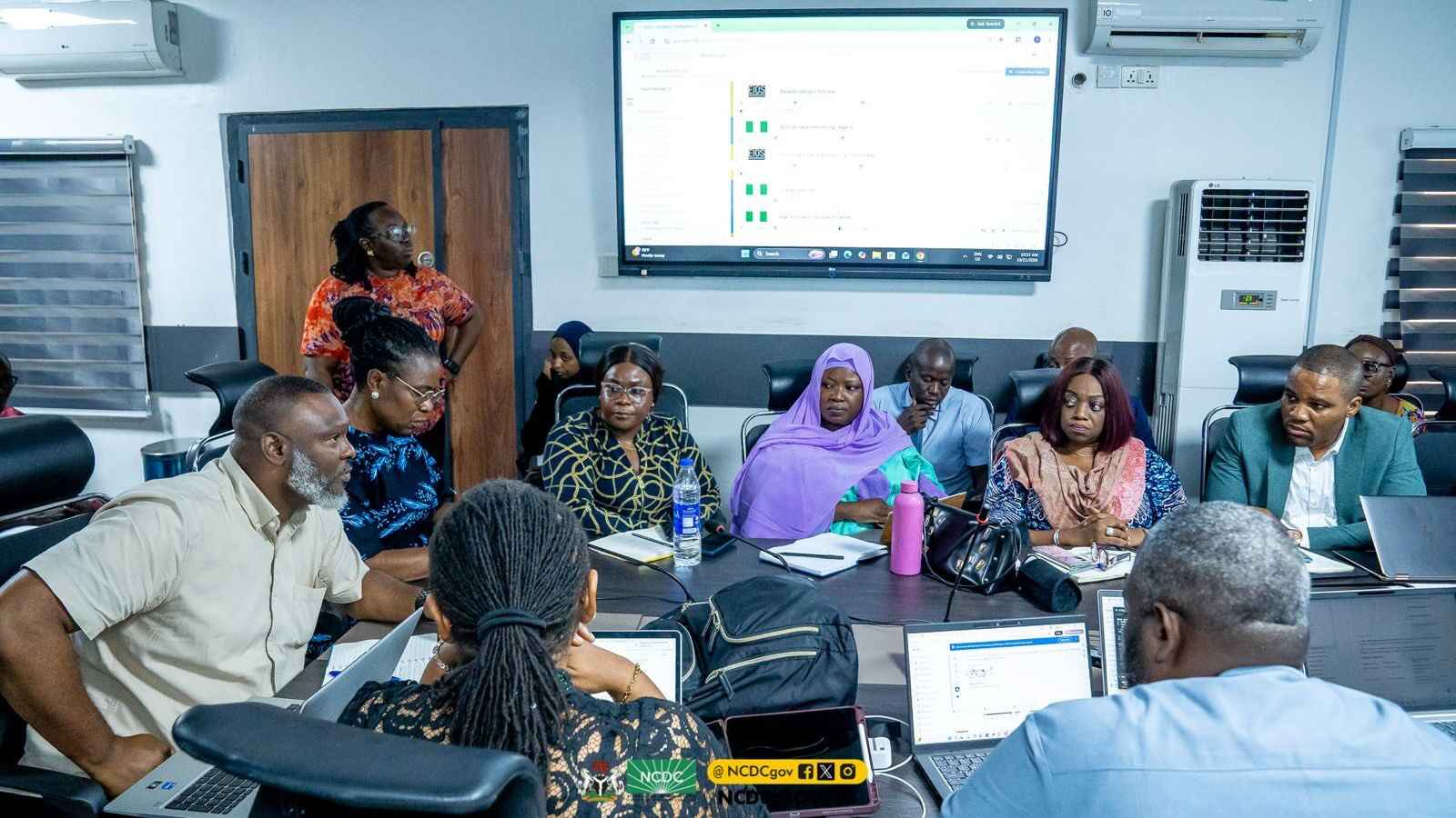 NCDC officials in a meeting.