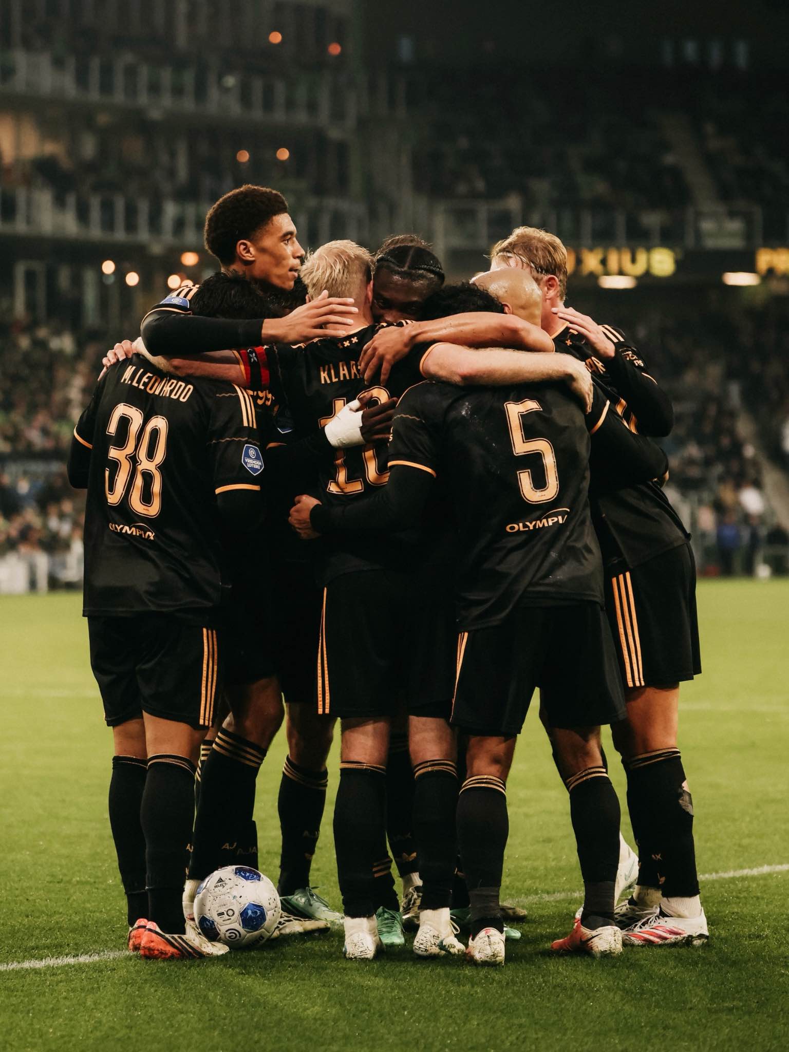 Ajax players celebrate their 5-2 victory.