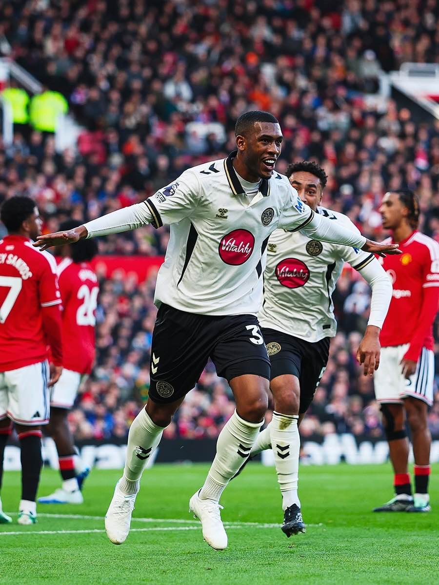 A Bournemouth player celebrates after finding the net against Manchester United at Old Trafford.