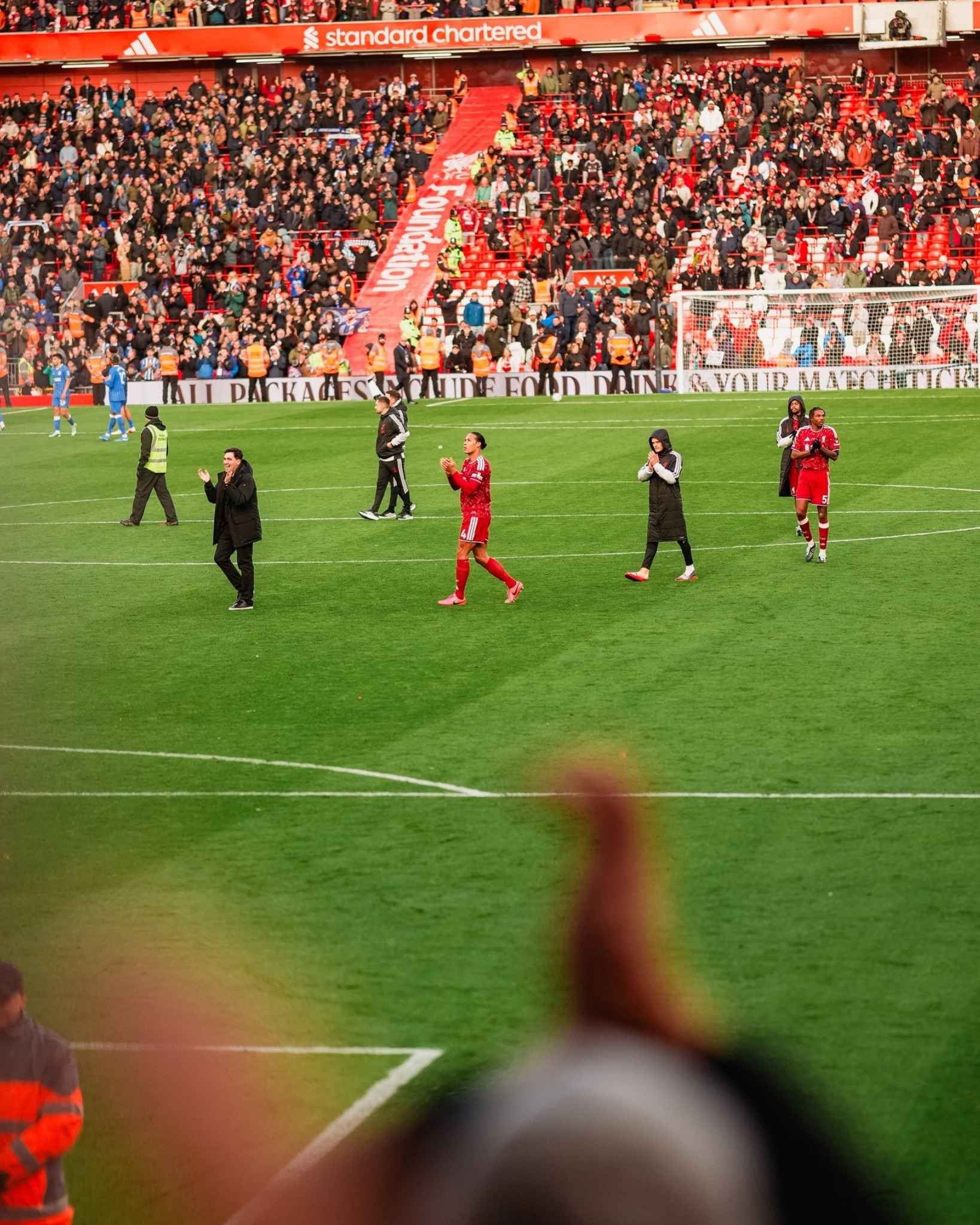 The Reds applaud supporters after securing a 2-0 victory over Brighton.