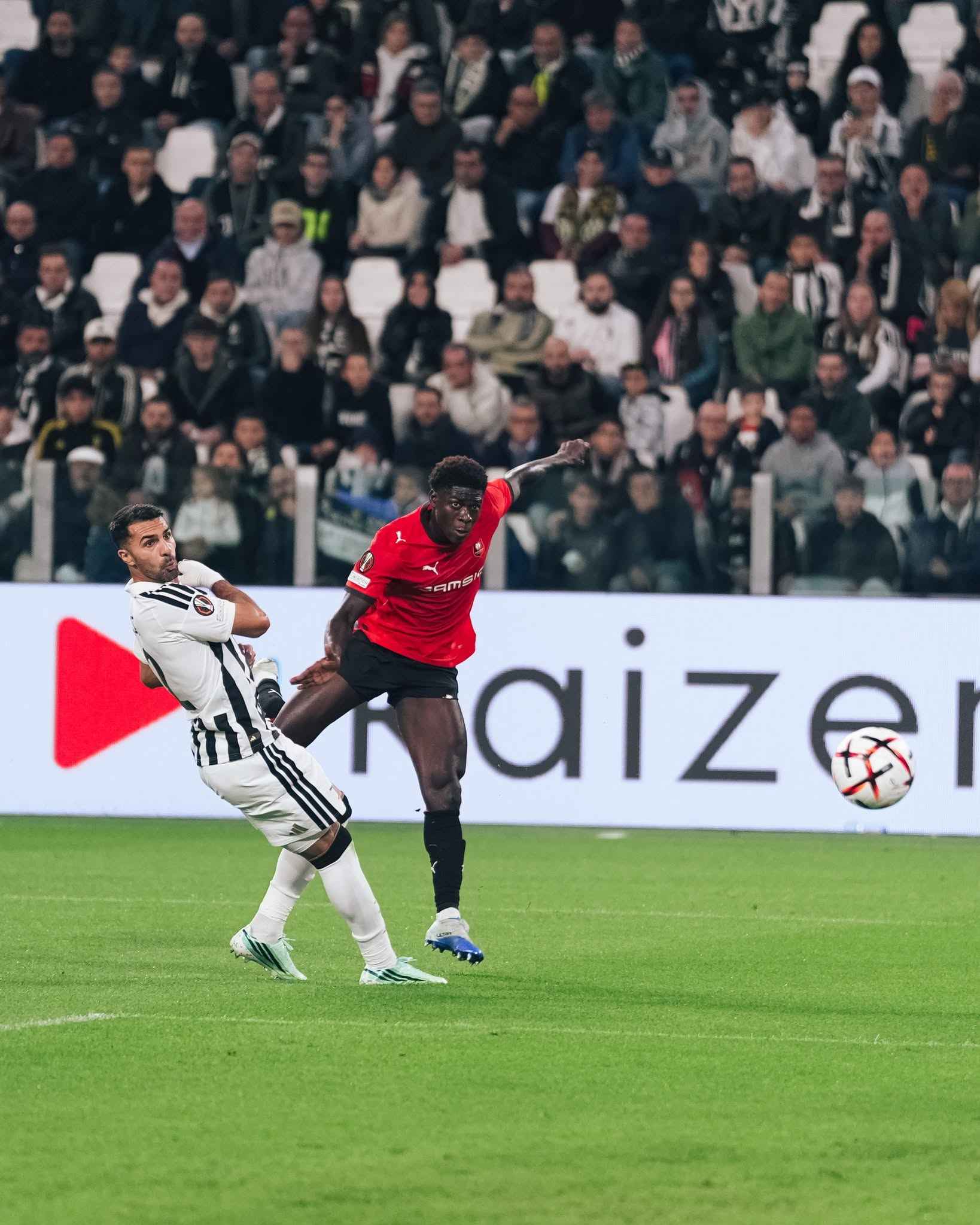 A Juventus player challenges a Rennes player during the Europa League clash.