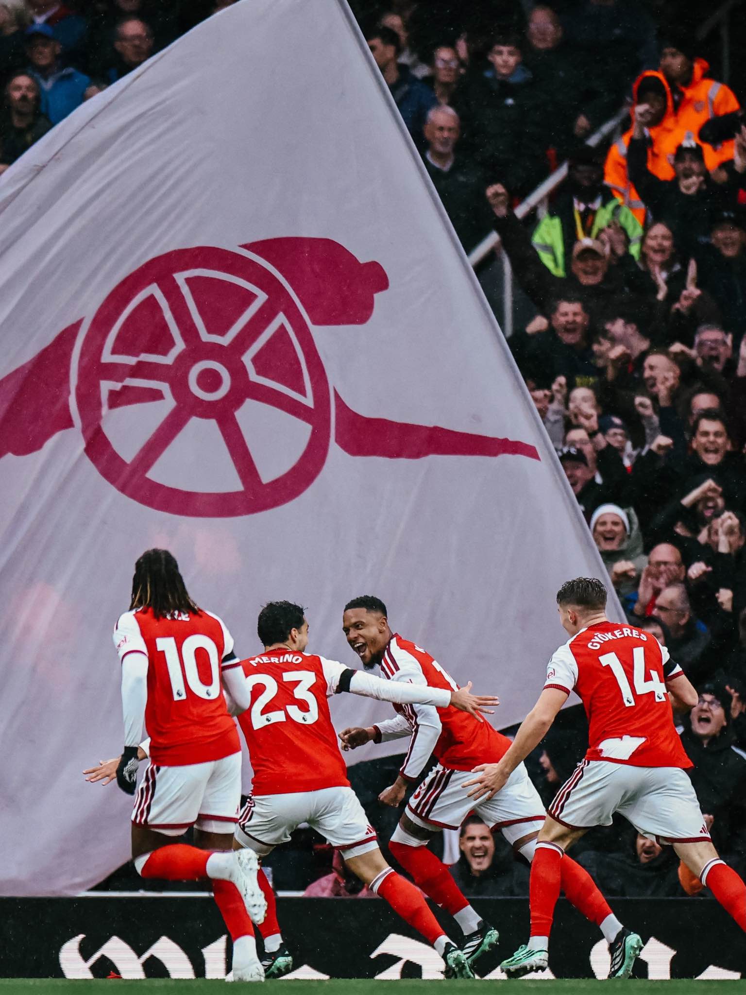 Arsenal players celebrate after securing a 2-0 win at the Emirates.