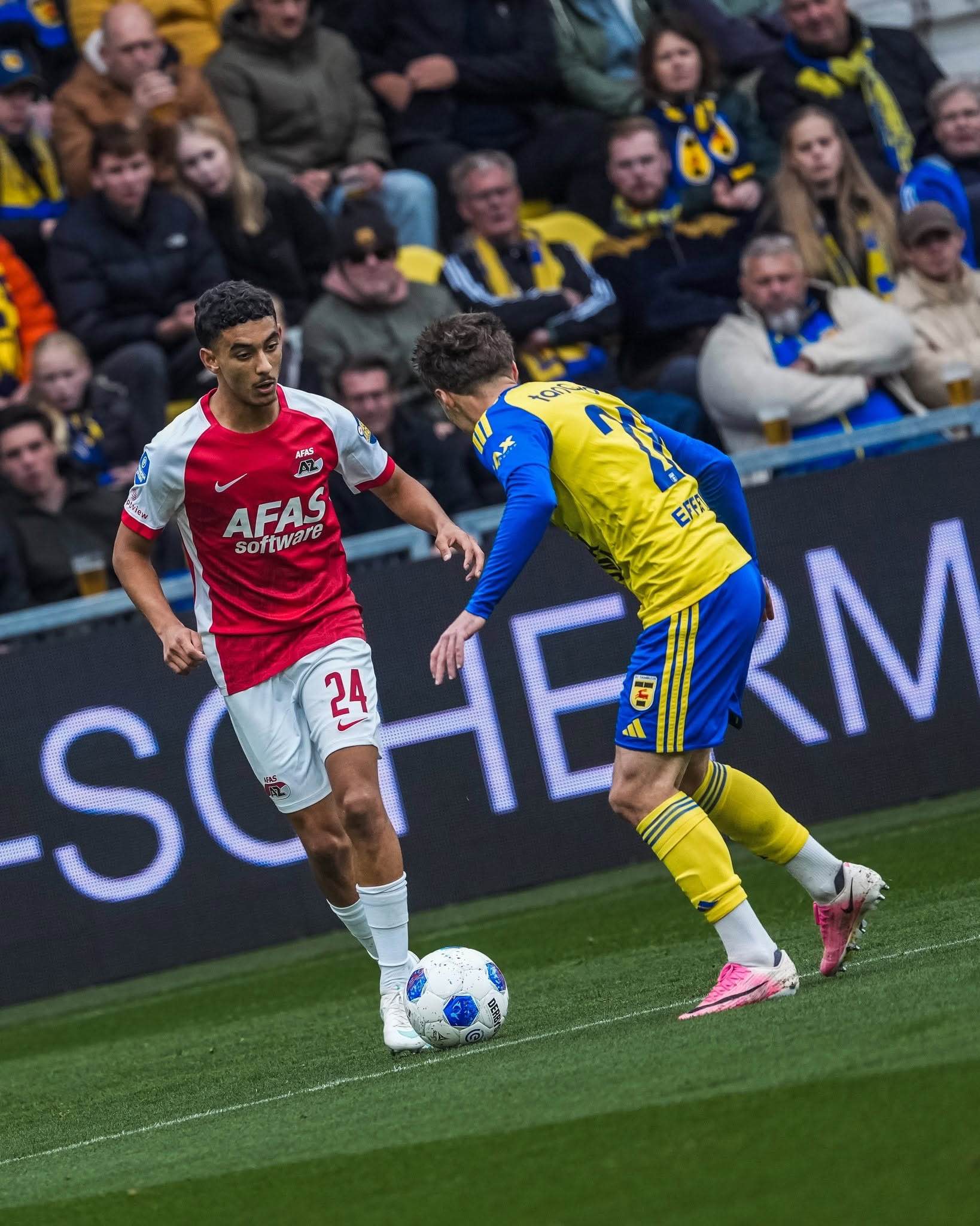 AZ player challenges for possession.