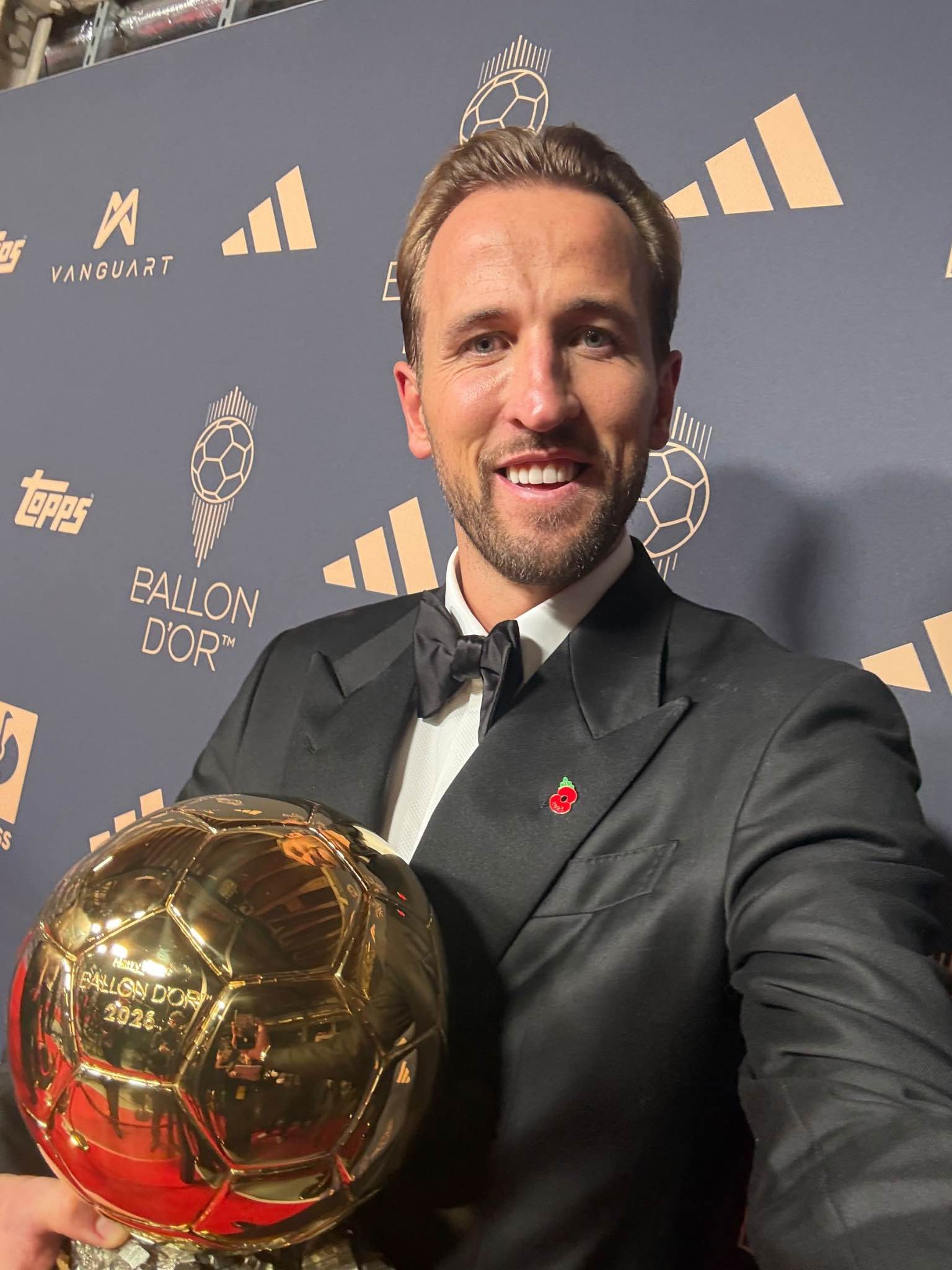 Harry Kane poses proudly with the Ballon d’Or trophy after his historic triumph.