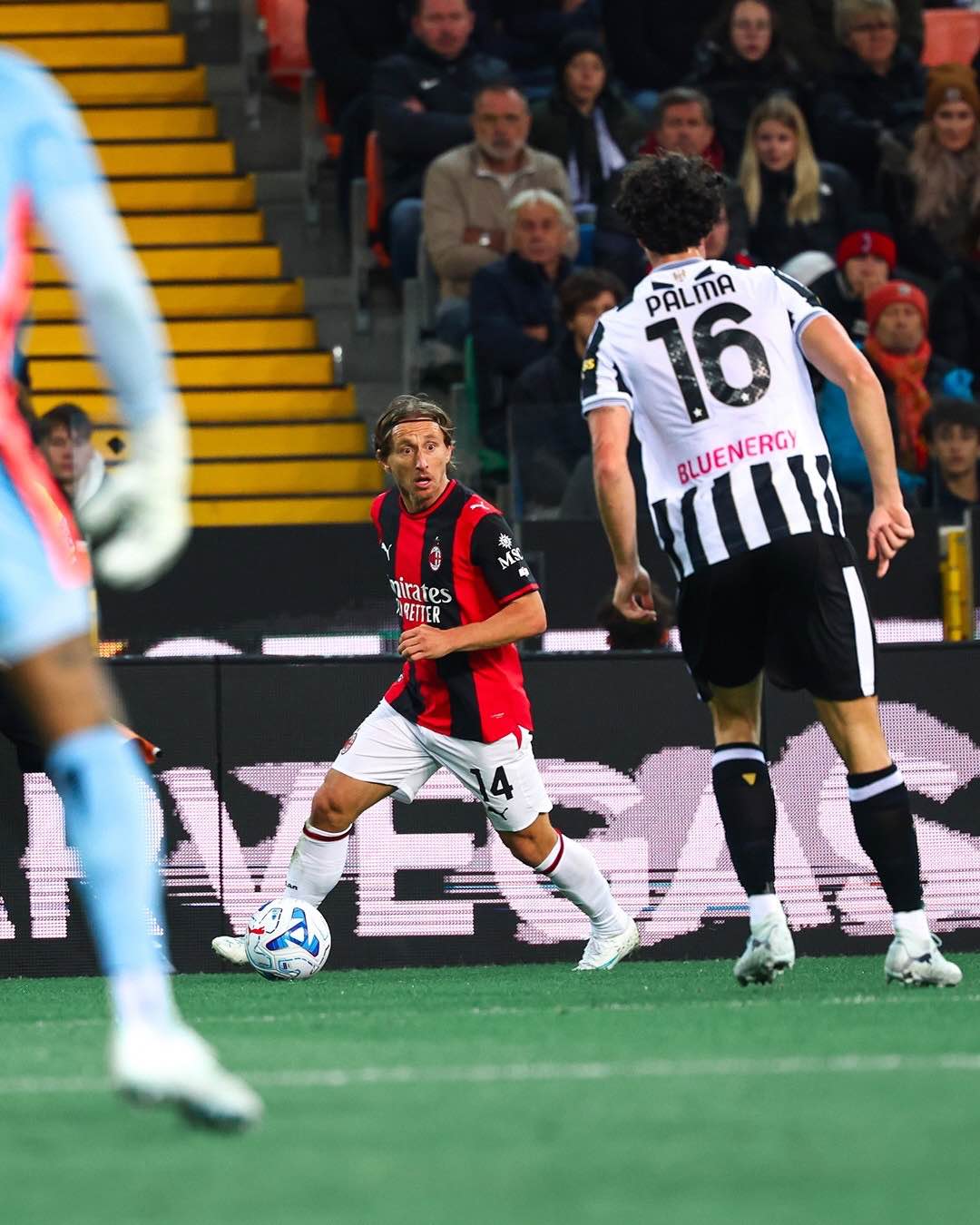 Luka Modrić carries the ball forward as Milan press for another attack.