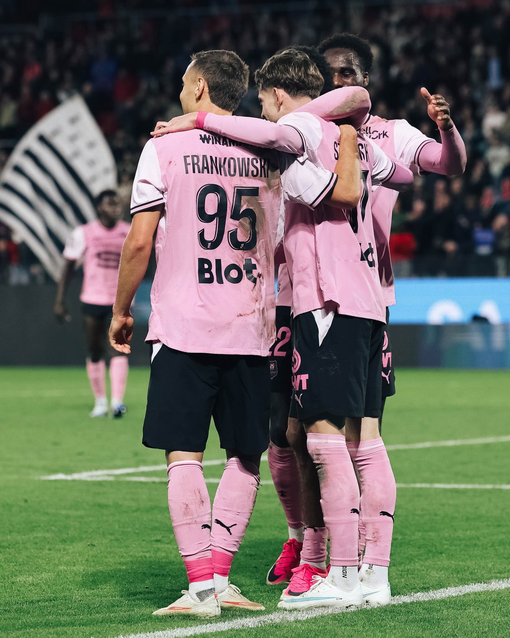 Rennes players celebrate together after their convincing win over Strasbourg.