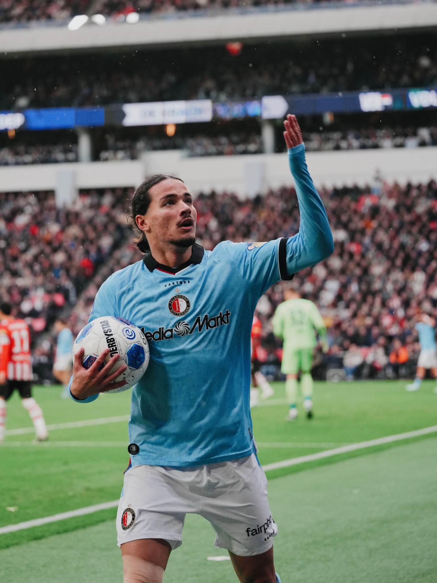 The Feyenoord forward acknowledges the supporters after scoring the decisive goal.